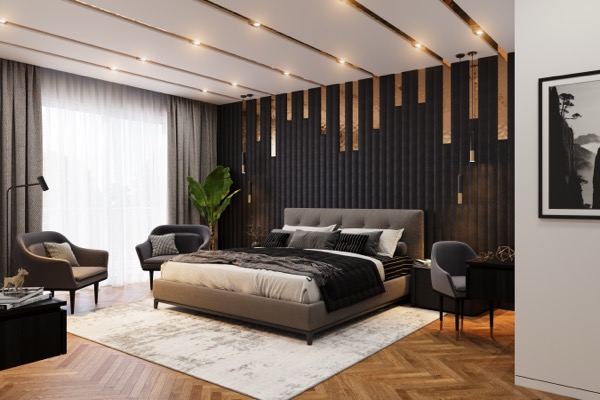 Elegantes Schlafzimmer mit schwarzer Polsterwand, Messingakzenten, grauem Doppelbett und Fischgrätparkett