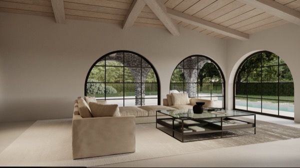 Helles Wohnzimmer mit beigem Ecksofa, Glas-Couchtisch, Holzbalkendecke und grossen Rundbogenfenstern mit Blick auf Pool