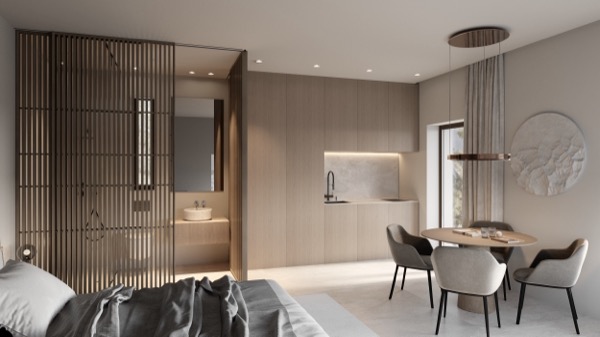 Helles Studio-Apartment mit Holzlamellen-Raumteiler zum Bad, heller Einbauküche und rundem Esstisch mit Polsterstühlen